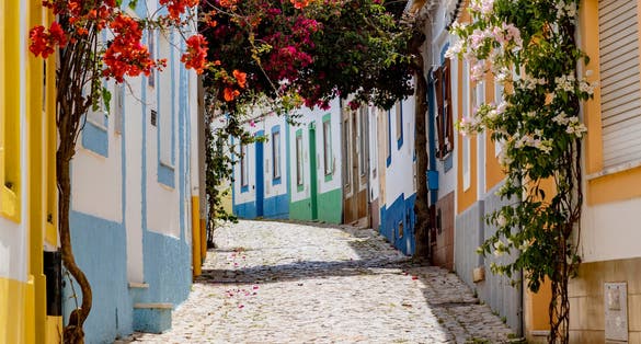 Photo of the beautiful narrow Alleys of Faro, Portugal.