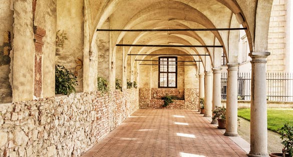 Photo of Medieval arcade corridor at Telc castle, Czech republic.