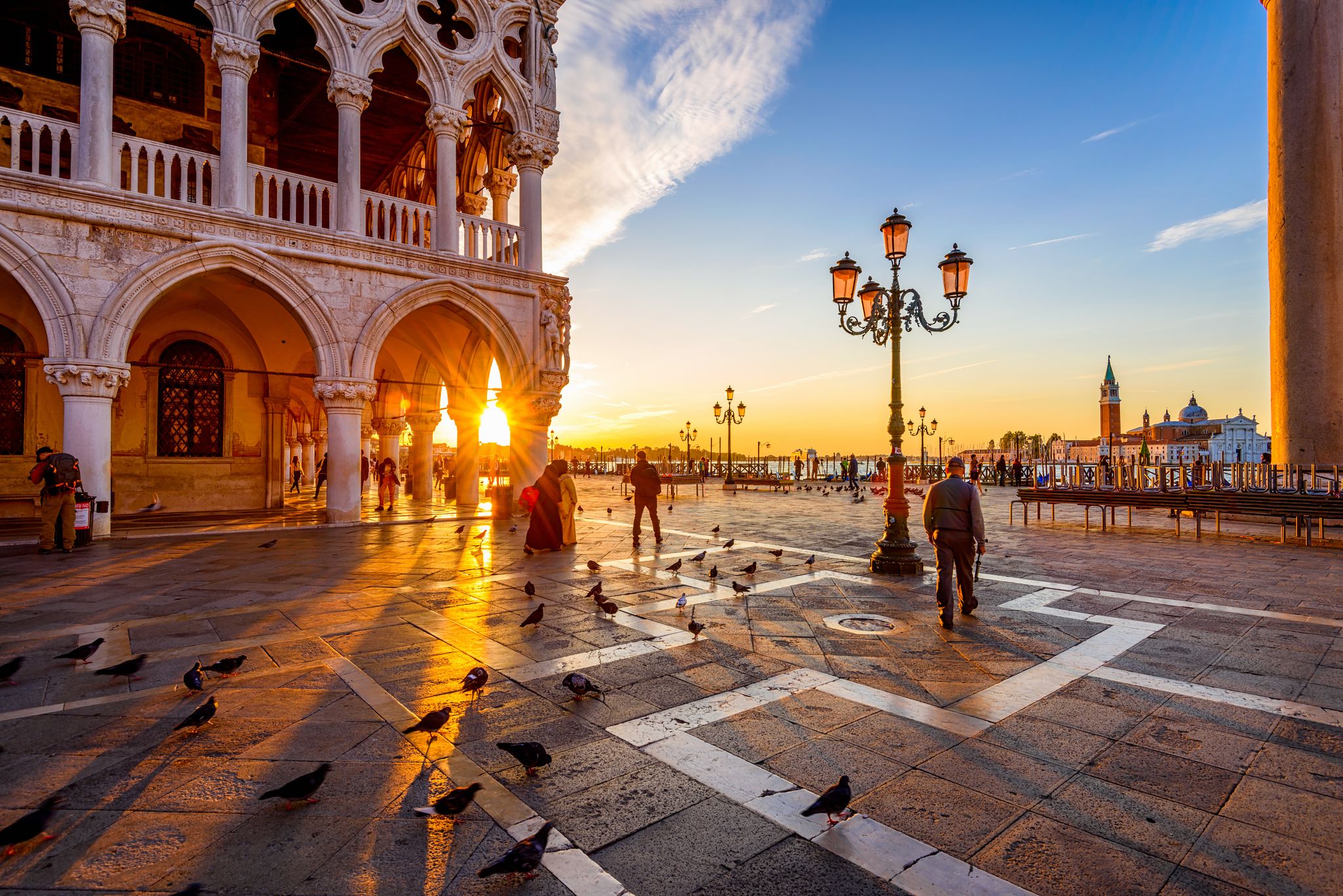photo of Sunrise view of piazza San Marco, Doge's Palace (Palazzo Ducale) in Venice, Italy. Architecture and landmark of Venice. Sunrise cityscape of Venice.