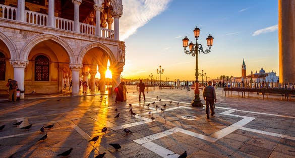 photo of Sunrise view of piazza San Marco, Doge's Palace (Palazzo Ducale) in Venice, Italy. Architecture and landmark of Venice. Sunrise cityscape of Venice.