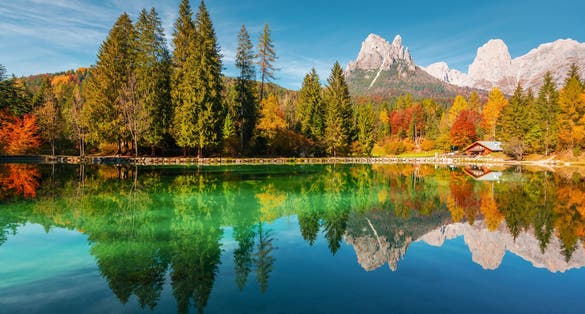 Picturesque view at autumn Welsperg lake in Dolomite Alps. Canali Valley, Primiero San Martino di Castrozza, Province of Trento, Italy. Landscape photography