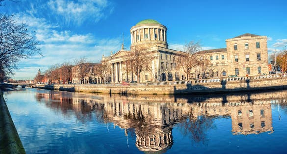 Four courts building in Dublin, Ireland with river Liffey.