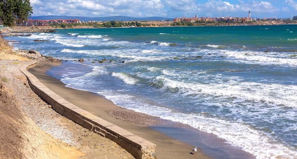 Aheloy, Bulgaria coastline, turquoise sea waves beach panorama background and Ravda town on the Black Sea