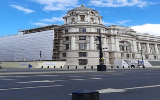 London, England - Panoramic skyline view of Bank and Canary Wharf, central London's leading financial districts with famous skyscrapers at golden hour sunset with blue sky and clouds.