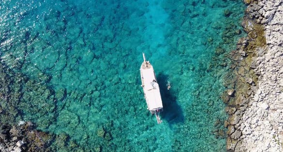 A boat on a magnificent sea, shooting with drone, Antalya, Kas, Turkey.