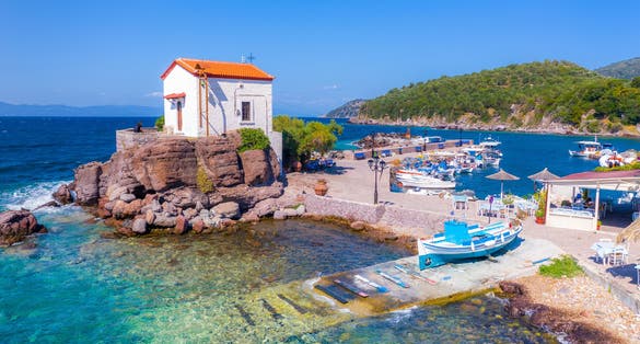 Photo of the little church of Panagia gorgona situated on a rock ,seaside village of Lesvos.