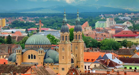 Photo of Sibiu cityscape with Holy Trinity Cathedral in Transylvania, Romania.