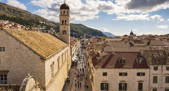 Photo of aerial view of the main street (Stradun or Placa), the Franciscan Monastery, St. Saviour Church in Dubrovnik, Croatia.