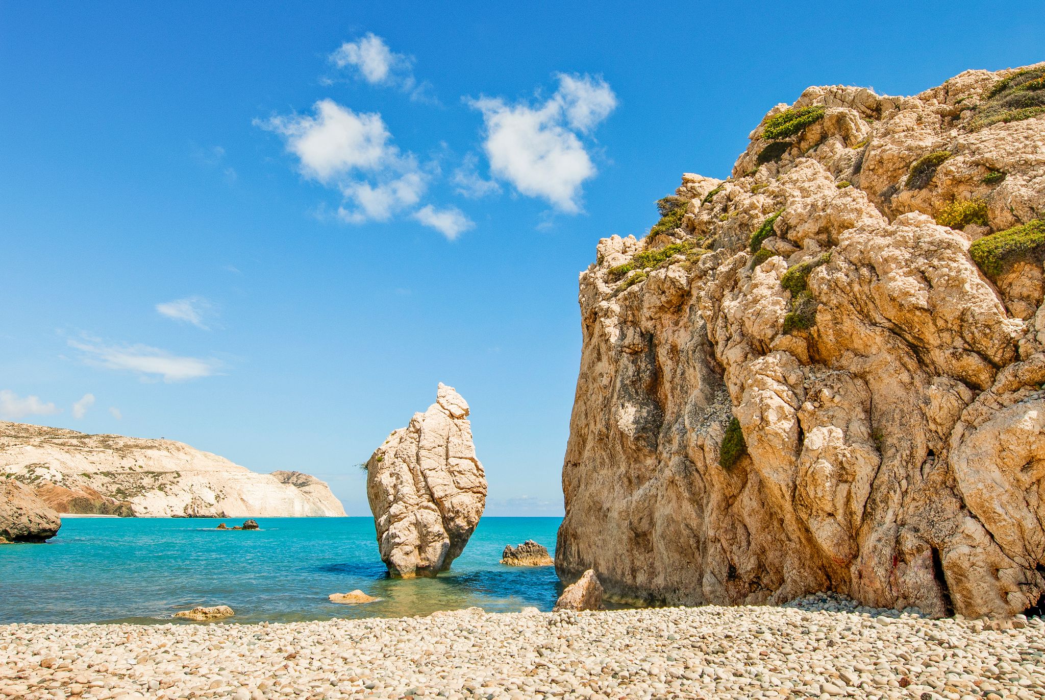 Photo of the famous beautiful beach of Aphrodite's rock or Venus rock, Petra tou Romiou, Cyprus.