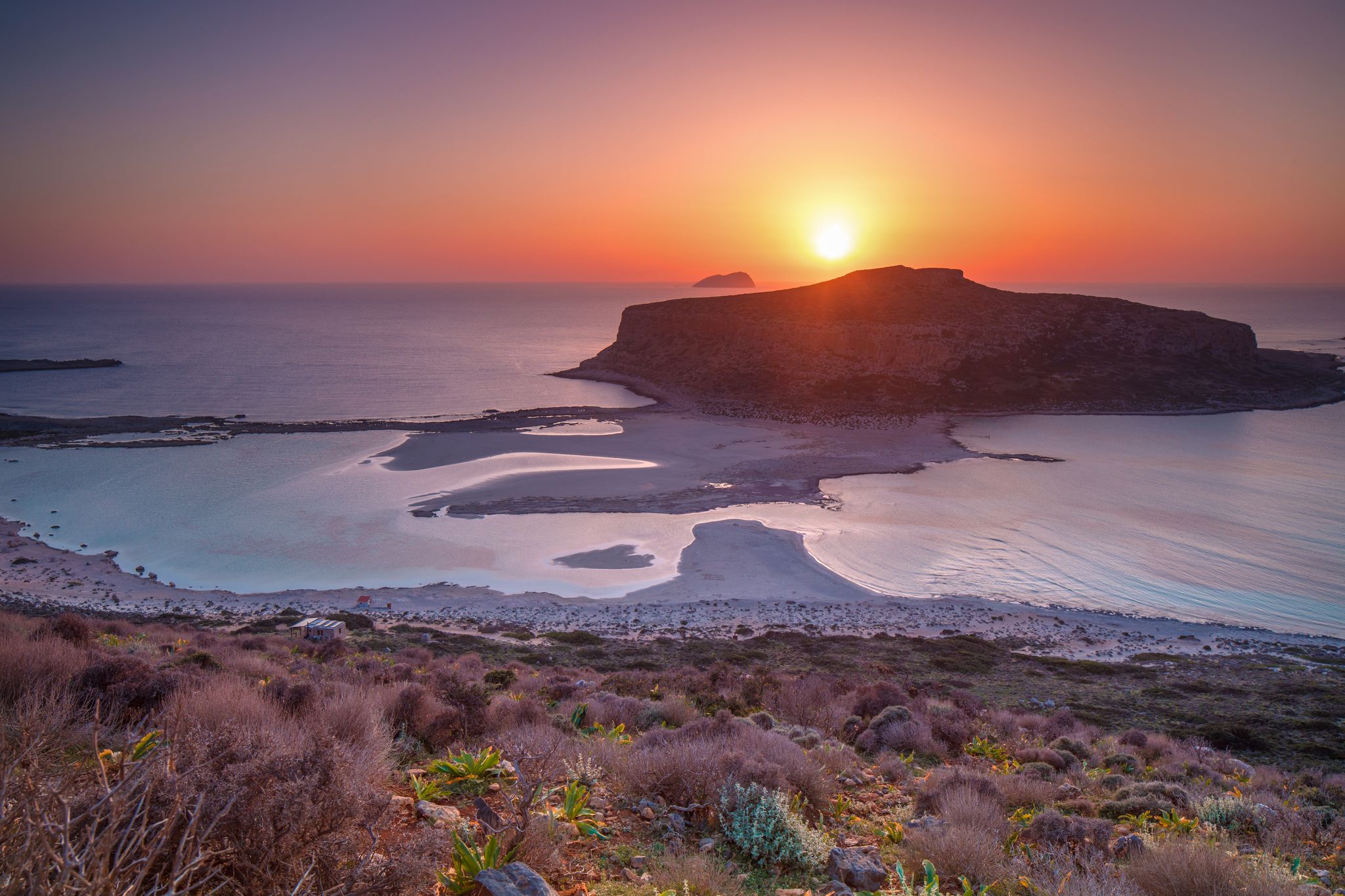 photo of view of Sunset over island Gramvousa and the Balos beach in Crete, Greece.