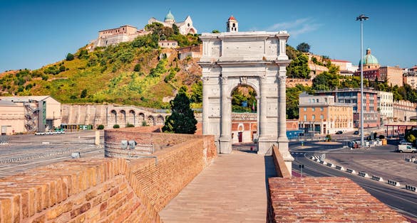 Bright morning view of Arch of Trajan and Cattedrale di San Ciriaco church. Wonderful summer cityscape of Ancona town, Italy, Europe. Traveling concept background.