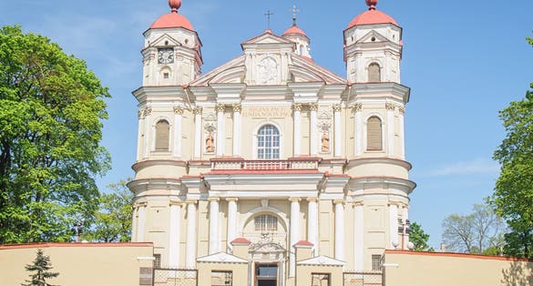 photo of tow tourist visiting church of st peter and st paul, Vilnius ,Lithuania.