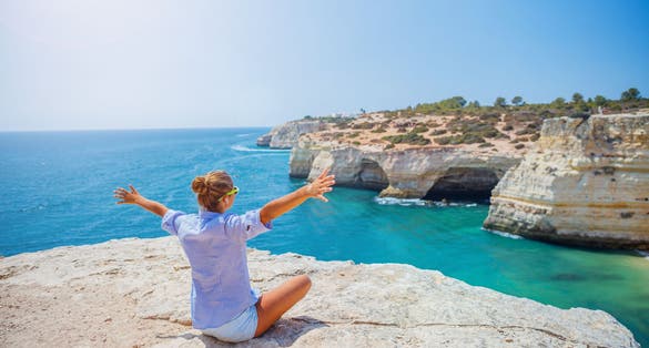 Photo of Girl looking out on the ocean ,Portimao, Portugal.