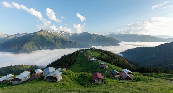 Photo of traditional wooden houses at highlands ,Pokut, Rize, Turkey.