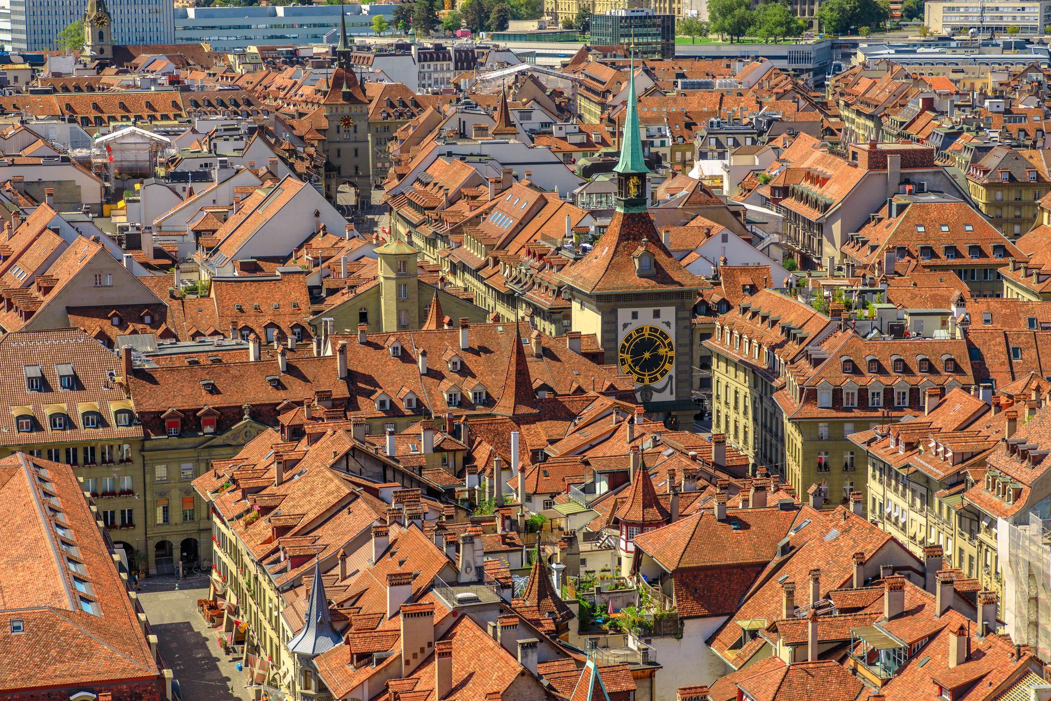 photo of aerial view of Bern old town, Switzerland, UNESCO World Heritage Site since 1983 from Cathedral bell tower. Details of Zytglogge or Clock Tower.