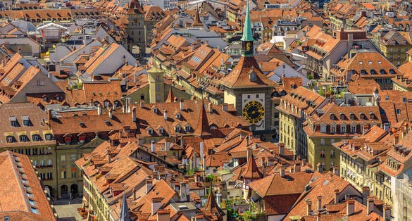 photo of aerial view of Bern old town, Switzerland, UNESCO World Heritage Site since 1983 from Cathedral bell tower. Details of Zytglogge or Clock Tower.