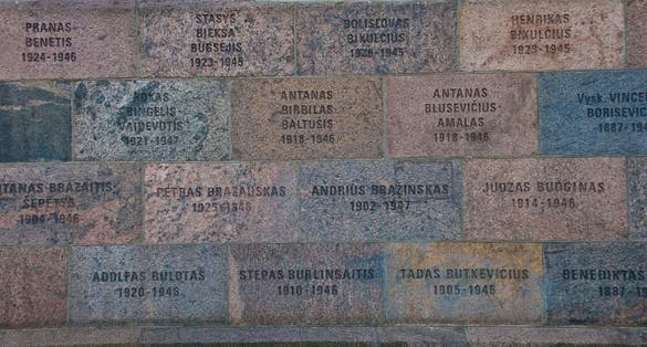 Wall outside the museum, engraved with names of those killed inside