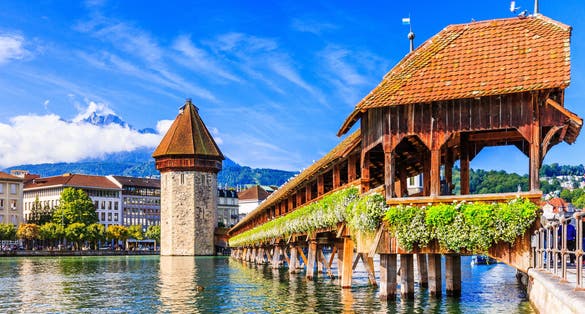 Lucerne, Switzerland. Historic city center with its famous Chapel Bridge and Mt. Pilatus on the background. (Vierwaldstattersee),