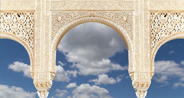 Photo of Arches in Islamic (Moorish) style in Alhambra, Granada, Spain .