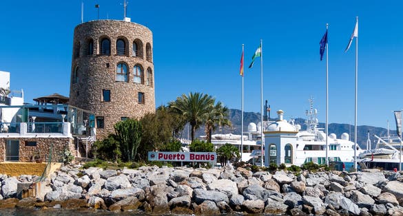 Harbour entrance with the watchtower to the left and La Concha mountain to the rear, Puerto Banus, Marbella, Costa del Sol, Malaga Province, Andalusia, Spain, Western Europe.