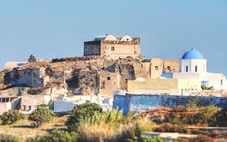 Photo of beautiful White architecture of Oia village on Santorini island, Greece.