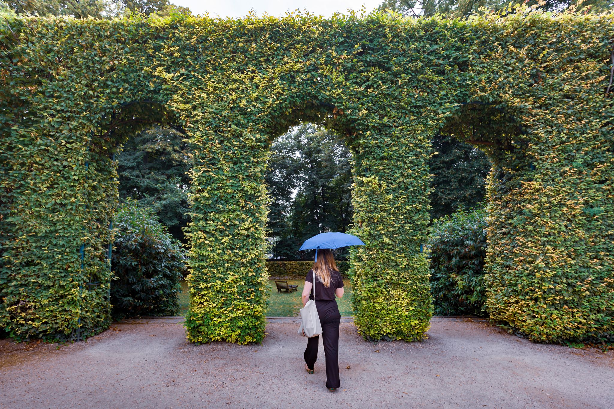 The gardens of The Musée Rodin in Paris, France with woman walking