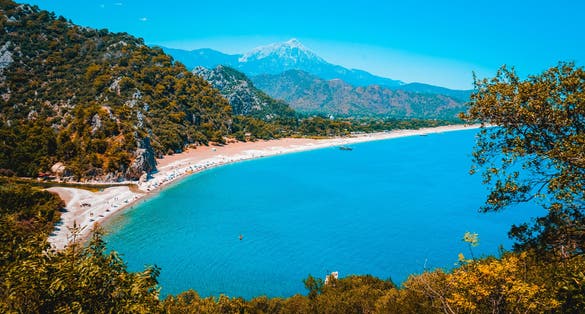 Photo of Cirali beach and Olimpos (Olympos) mountain in a sunset light. Kemer, Antalya, Mediterranean region, Turkey.