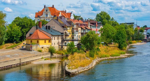 Colorful houses at waterfront of Danube river in Regensburg, Germany.