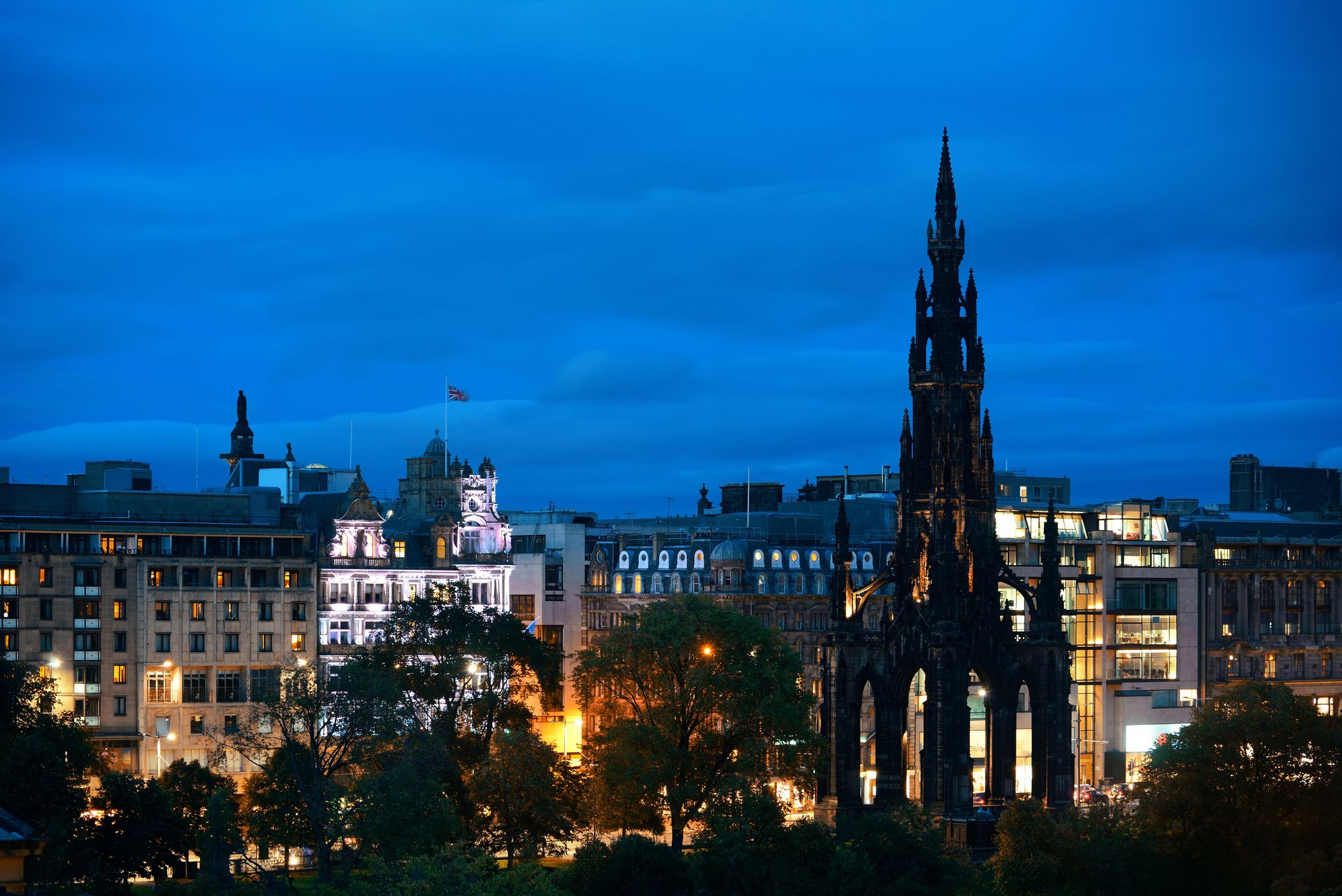 Photo of Edinburgh city view with Scott Monument at night in scotland.