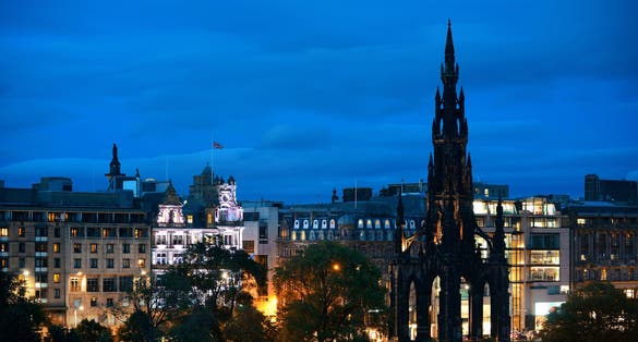 Photo of Edinburgh city view with Scott Monument at night in scotland.