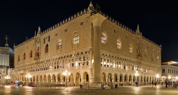photo of Night view of St. Mark's Square ;Piazza San Marco, in front of Palazzo Ducale; Doge's Palace and Colonne di San Marco e San Teodoro, unique bronze and marble statues, in Venice, Italy.