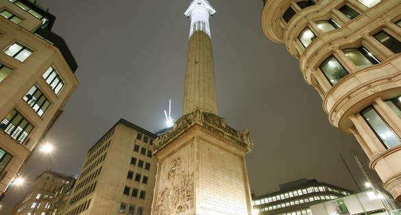 Photo of Monument to the Great Fire of London at night , UK.