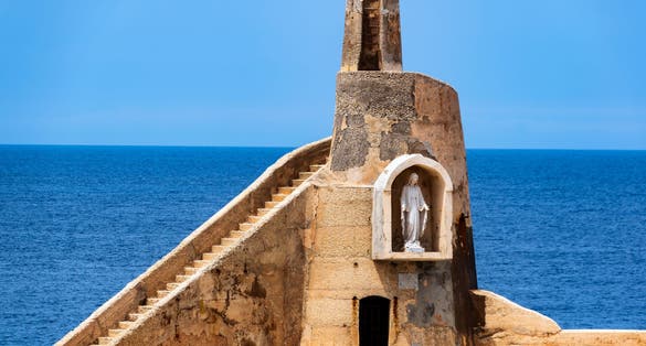A statue of the Virgin Mary at one corner of Malta's Cirkewwa harbour where the Gozo ferry arrives.