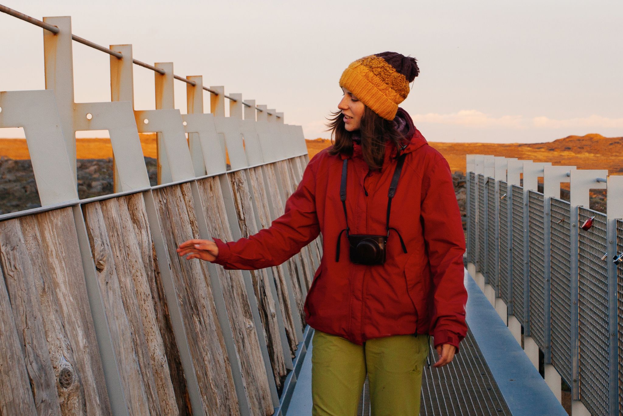 photo of Woman traveling Iceland. In famous bridge between continents .