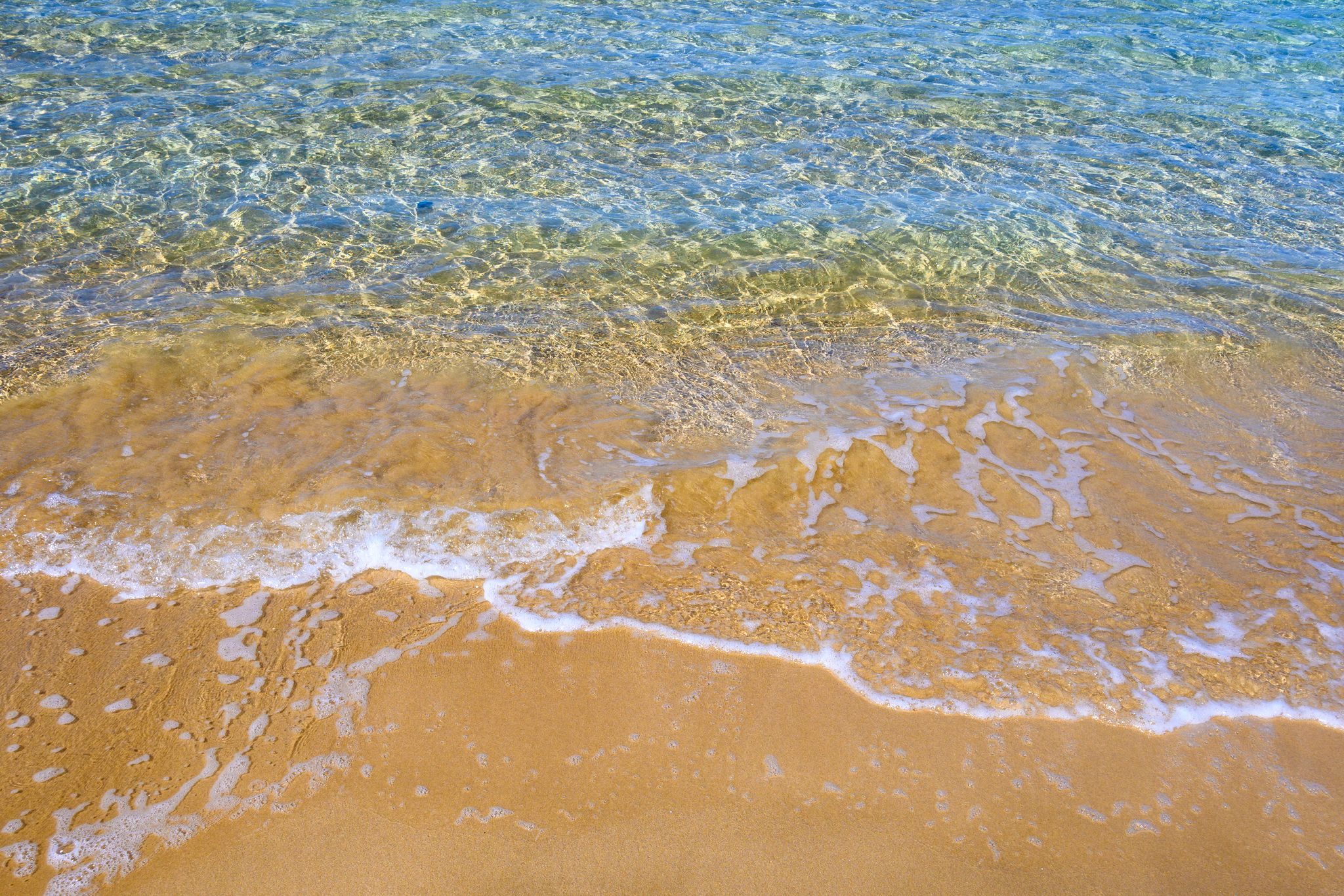 Photo of golden sand and emerald water. Santa Maria beach, Parikia ,Paros Island, Cyclades, Greece.