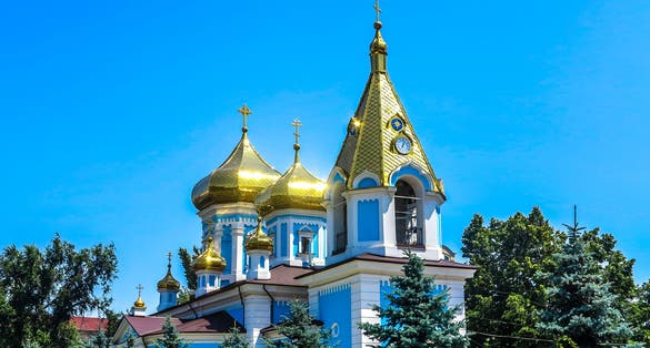 Photo of Chisinau Ciuflea Monastery Saint Theodore Tyro, Main Church Side View with Golden Cupola Crosses, Moldova.