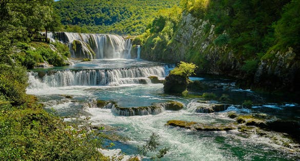 photo of Una canyon with waterfalls cascade Strbacki buk in National Park Una in Bihać near Kulen Vakuf, Bosnia and Herzegovina.