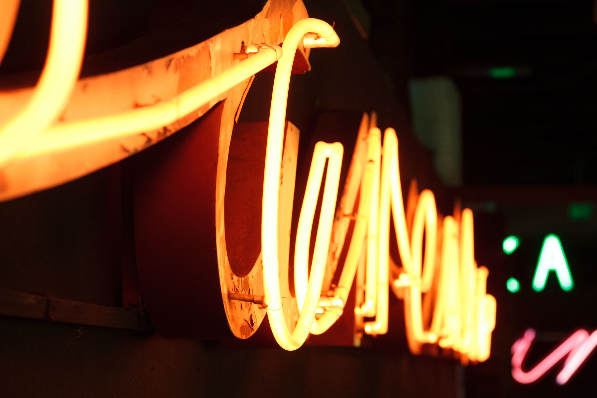 Close-up photo of old neon sign. Retro advertising in Warsaw neon museum
