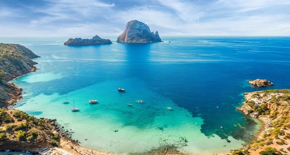 Photo of aerial view of Cala d’Hort, Ibiza islands, Spain.