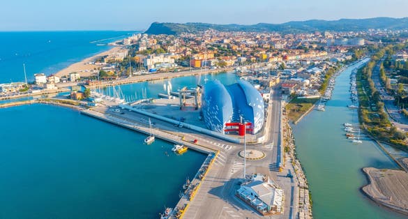 panoramic aerial view outside the port of Pesaro where you can see the Levante and Ponente beaches, the port with the nautical center and the breakwater cliffs,the park mountain of San Bartolo