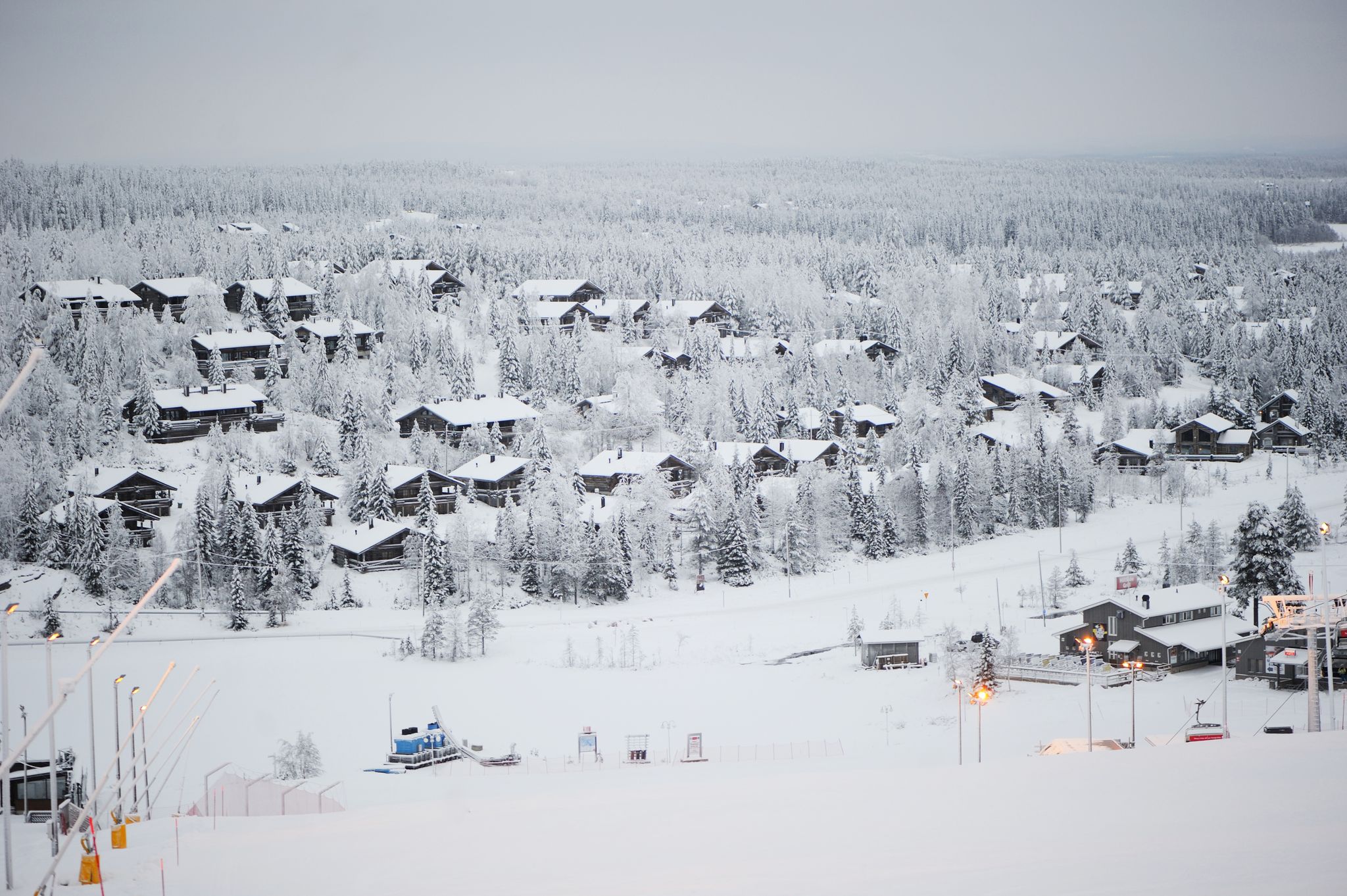 photo of beautiful view of Finnish landscape with trees in snow, ruka, karelia, lapland, hilly winter landscapes in famous winter sports area called Ruka.