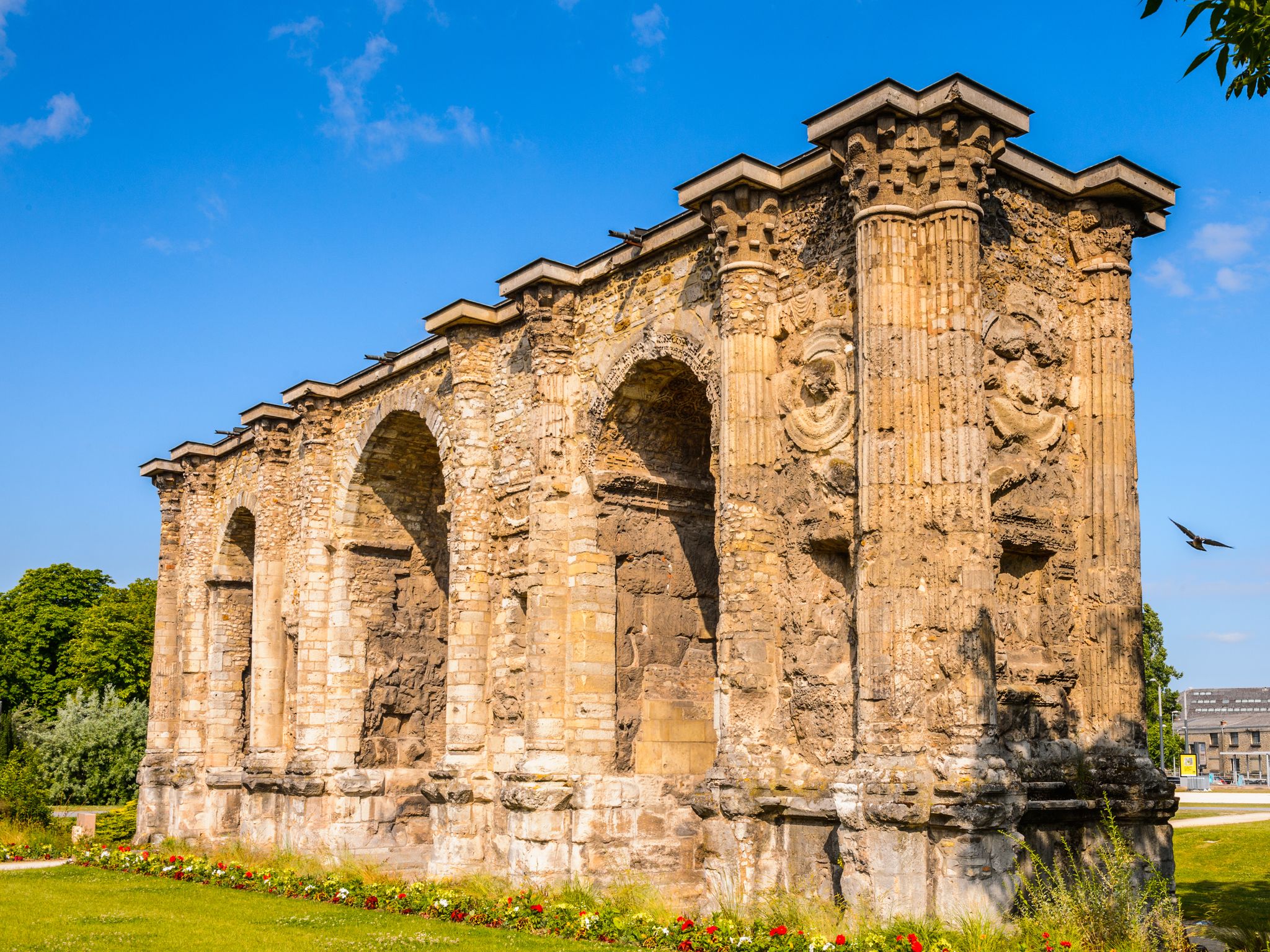 photo of Porte Mars, an ancient Roman triumphal arch in Reims, France.