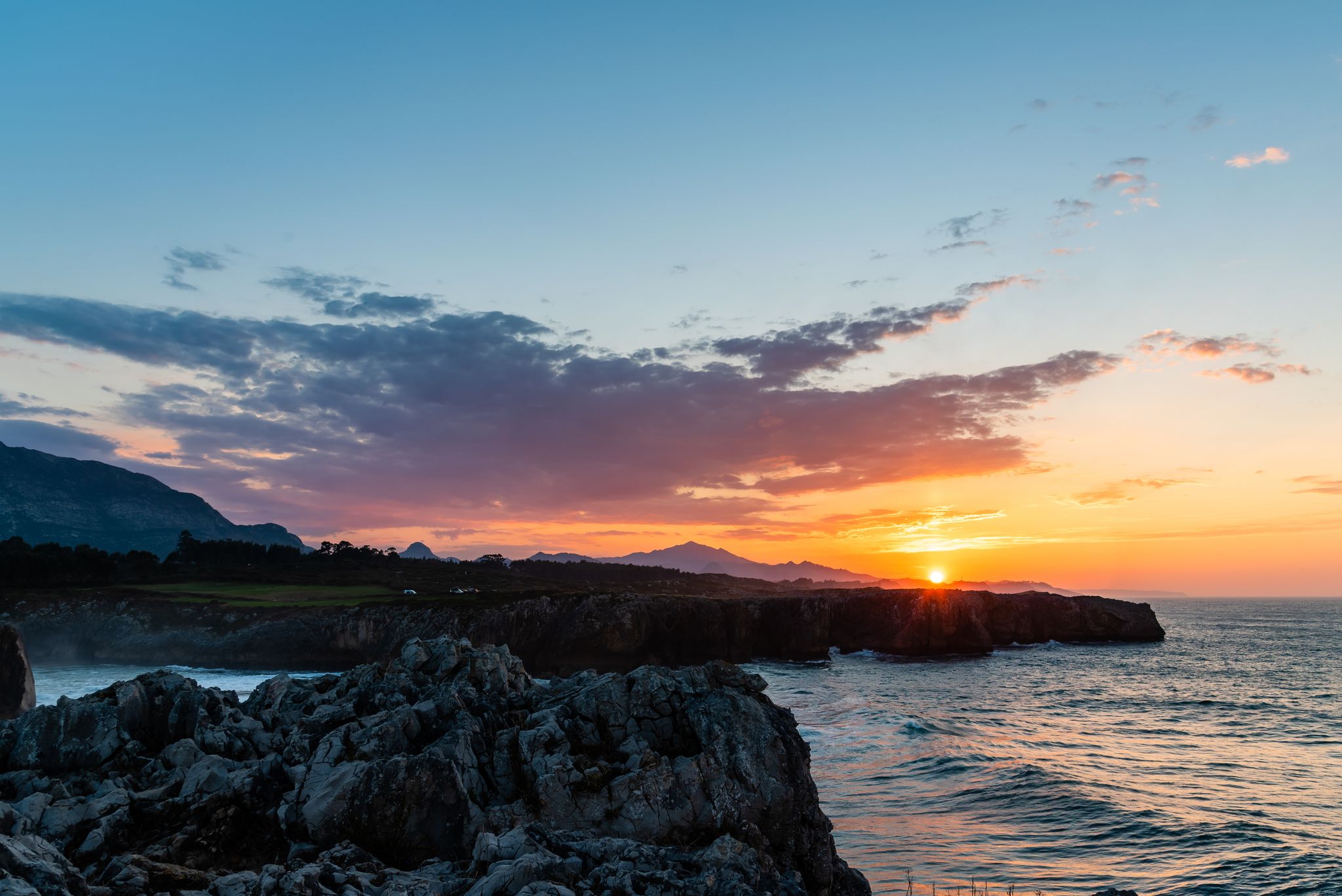 photo of cliffs at bufones of Pria at sunset in Llanes, Asturias, Spain.