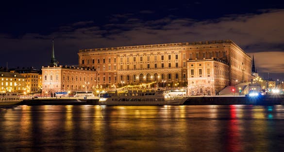 Photo of The Royal Palace at night that is located in Gamla Stan in Stockholm, Sweden.