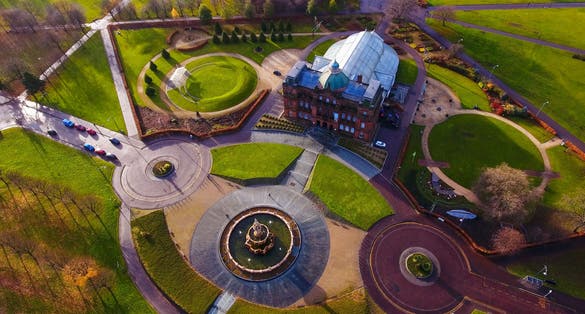 Aerial image of People’s Palace, Winter Gardens and Doulton Fountain at Glasgow Green lit by a low winter’s sun.