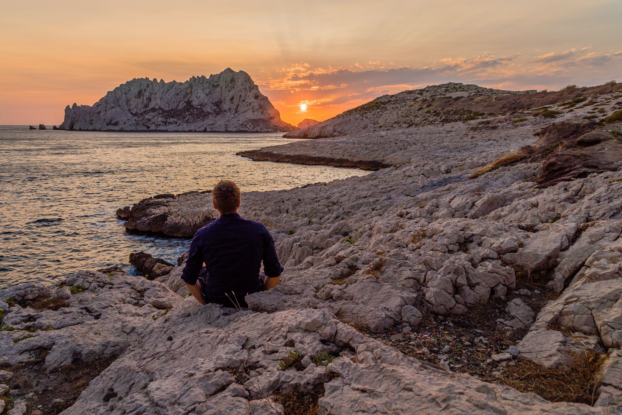 Sunset over the rocky coastline at Les Goudes near Marseille, with views of the sea and the Frioul Islands.jpg