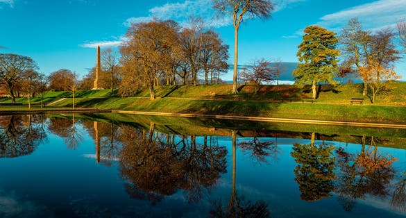Photo of The Duthie park, Aberdeen, Scotland, with reflections in the early morning light.