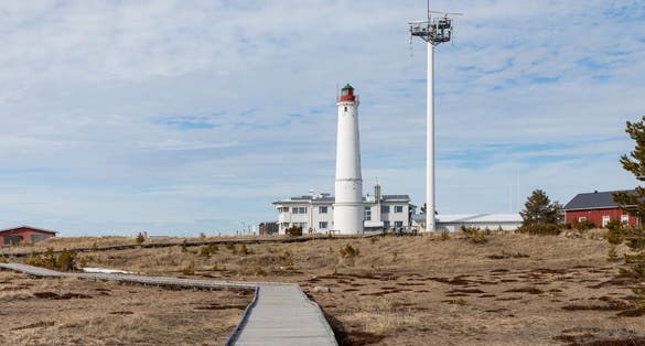Photo of Lighthouse at Hailuoto island, Marjaniemi beach, Finland coastline. 