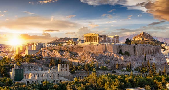 Photo of the Acropolis of Athens, Greece, with the Parthenon Temple on top of the hill.