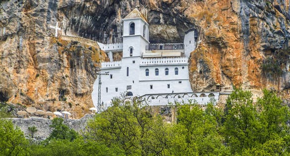 Photo of Monastery of Ostrog is a monastery of Serbian Orthodox Church placed against an almost vertical rock of Ostroska Greda, Montenegro.